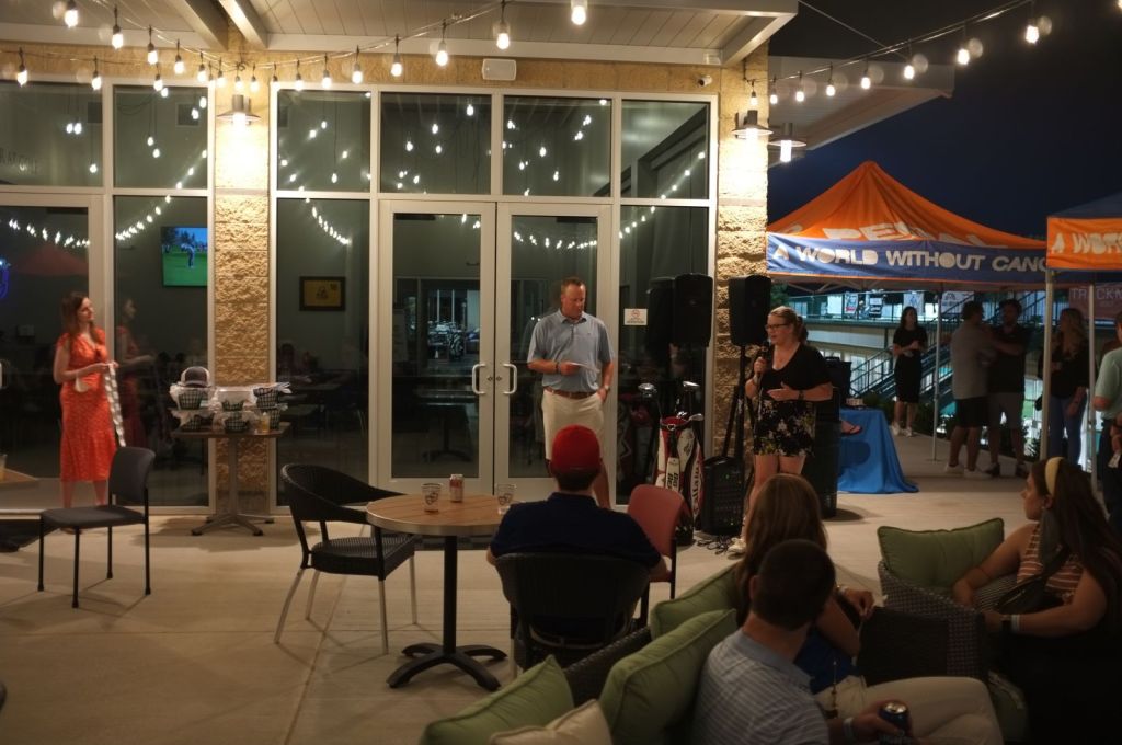 people having a good time in the patio area in the evening