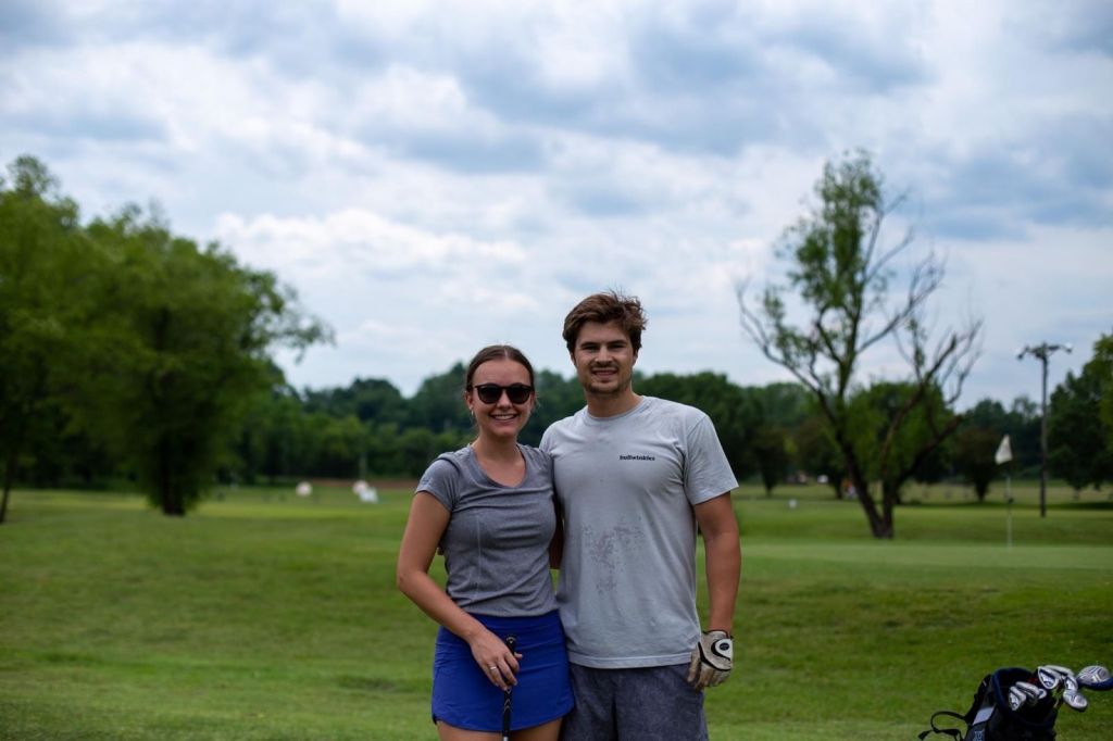 couple taking a picture on the course