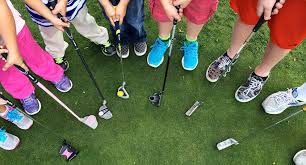 junior golfers gathered in a circle